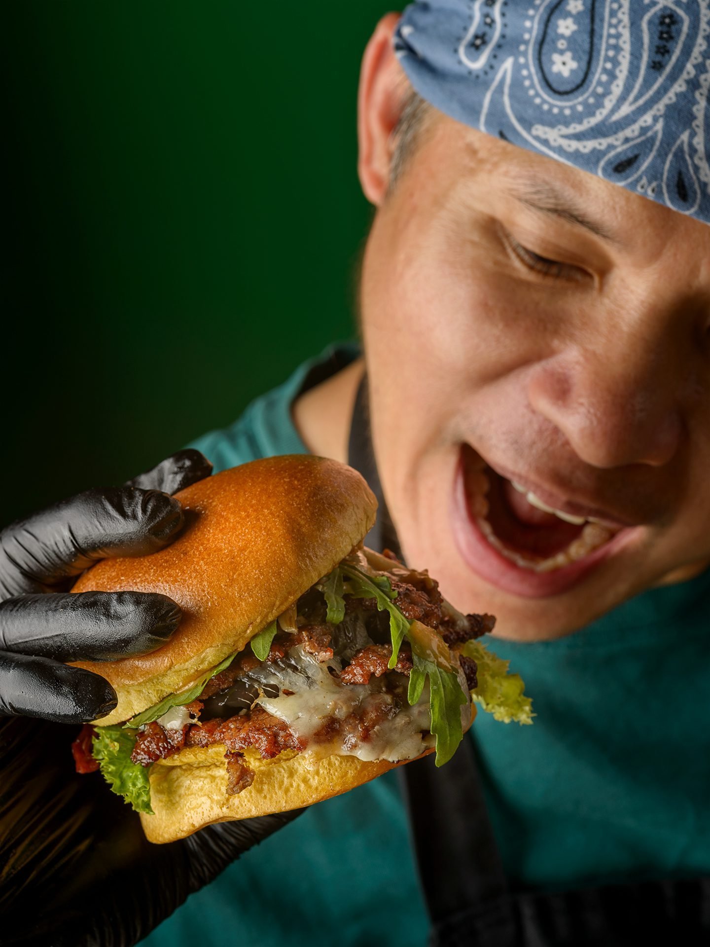 KOYA Chef holding Smash Burger