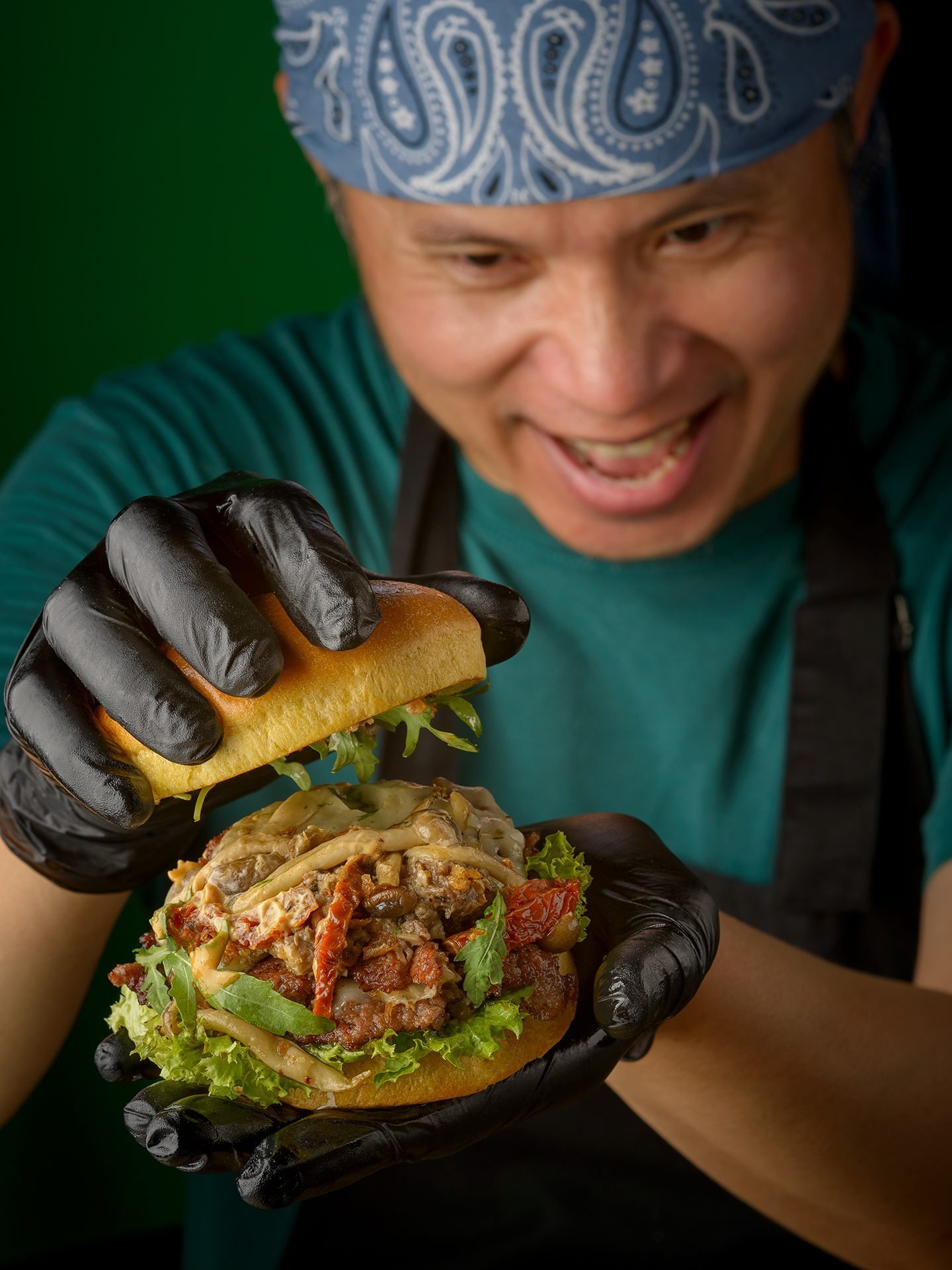 KOYA Chef smiling with Smash Burger